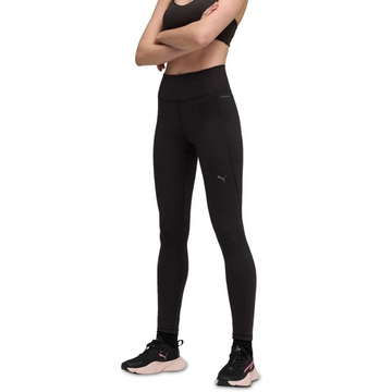 Person wearing black athletic leggings with a small logo on a white background