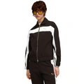 Person wearing a black and white tracksuit with a brand logo on a white background