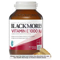 Blackmores Vitamin E 1000IU 100 Capsules bottle front view, featuring a green and gold design, showcasing the product's label and packaging.