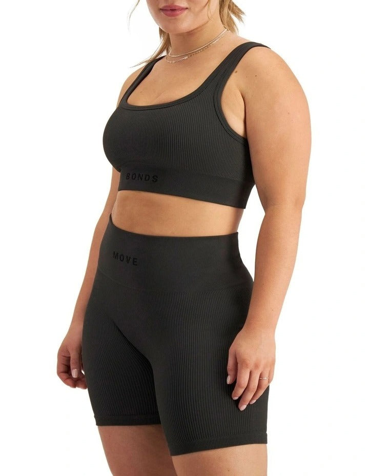 Move Rib Seamless Crop Top in ribbed nylon elastane with removable cups, soft v-neckline, moisture-wicking finish, and supportive underbust elastic