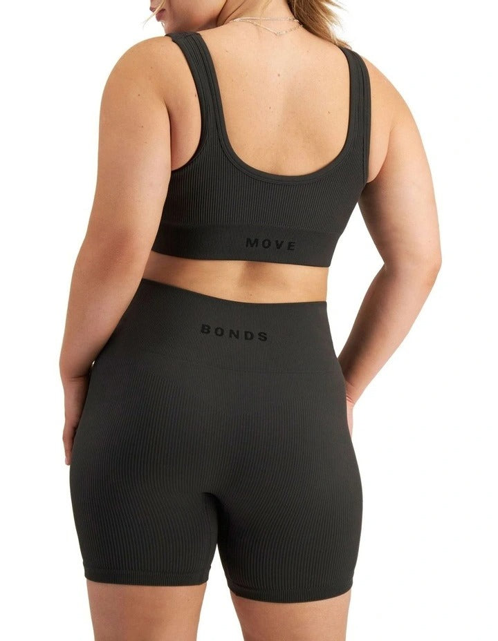 Move Rib Seamless Crop Top in ribbed nylon elastane with removable cups, soft v-neckline, moisture-wicking finish, and supportive underbust elastic
