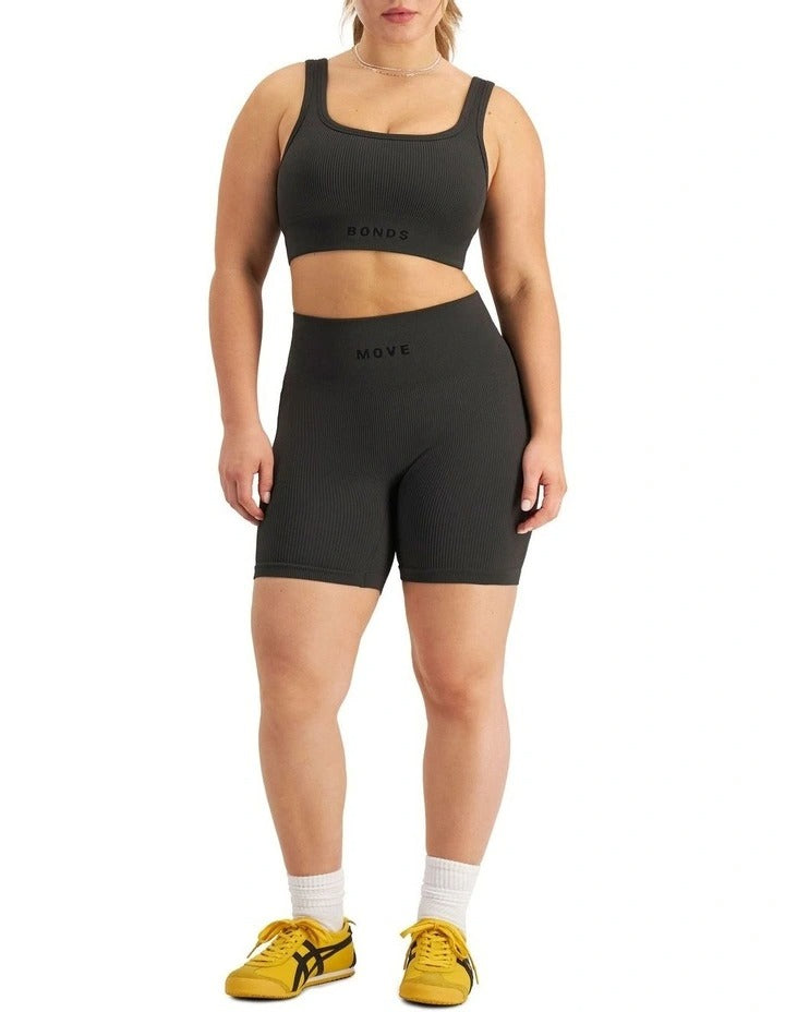 Move Rib Seamless Crop Top in ribbed nylon elastane with removable cups, soft v-neckline, moisture-wicking finish, and supportive underbust elastic