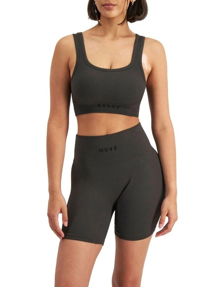Move Rib Seamless Crop Top in ribbed nylon elastane with removable cups, soft v-neckline, moisture-wicking finish, and supportive underbust elastic
