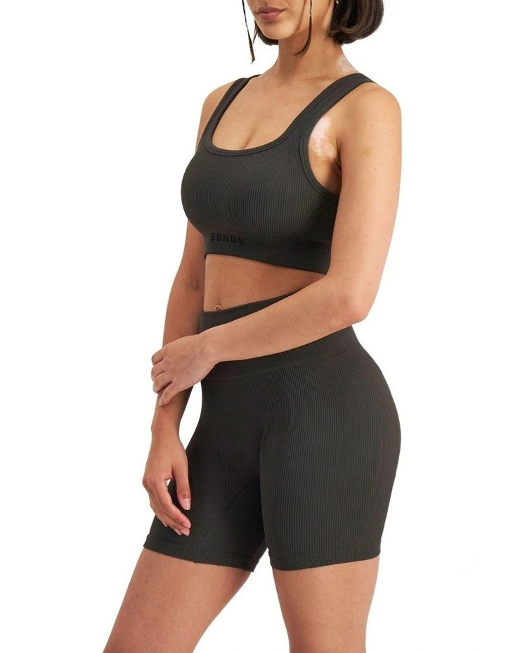 Move Rib Seamless Crop Top in ribbed nylon elastane with removable cups, soft v-neckline, moisture-wicking finish, and supportive underbust elastic