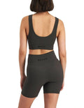 Move Rib Seamless Crop Top in ribbed nylon elastane with removable cups, soft v-neckline, moisture-wicking finish, and supportive underbust elastic