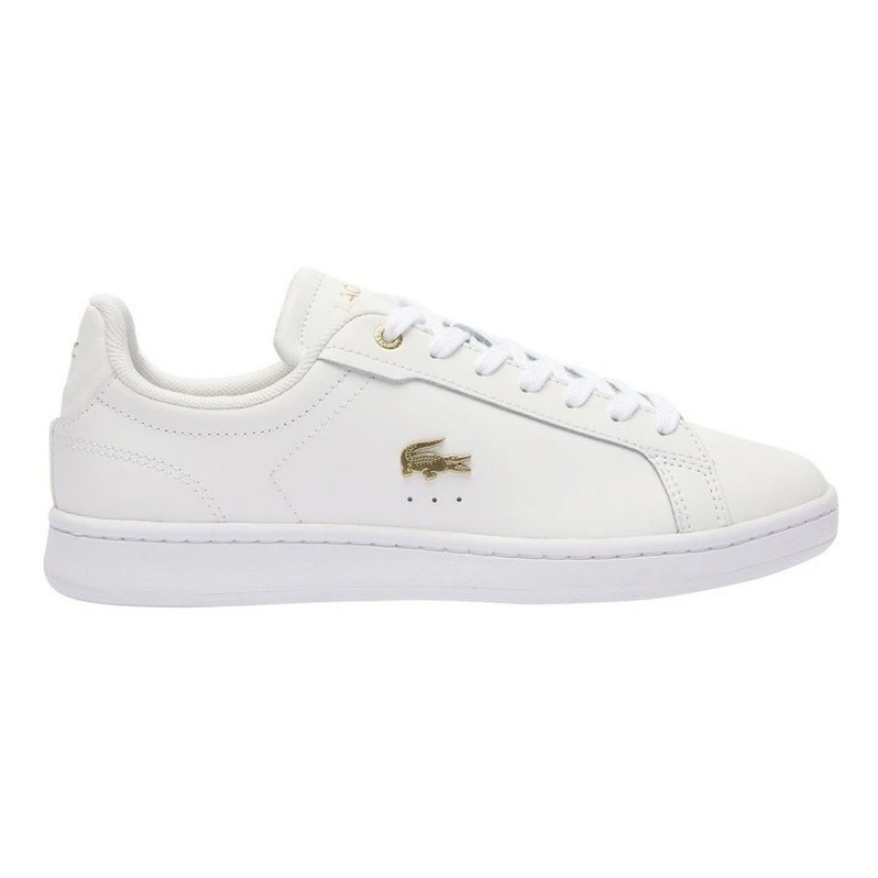 Lacoste Carnaby Pro Leather Sneakers in White/Gold, featuring a sleek leather upper with gold accents for a luxurious, stylish design.