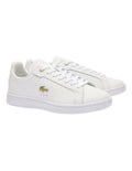 Lacoste Carnaby Pro Leather Sneakers in White/Gold, featuring a sleek leather upper with gold accents for a luxurious, stylish design.