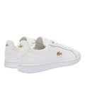 Lacoste Carnaby Pro Leather Sneakers in White/Gold, featuring a sleek leather upper with gold accents for a luxurious, stylish design.
