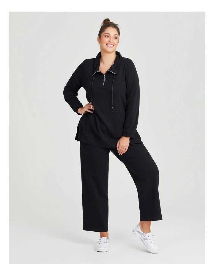 Taking Shape Funnel Neck Active Tunic in Black with long sleeves, half zip, kangaroo pocket, and ribbed details for plus size comfort.
