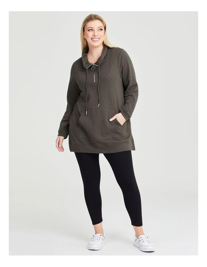 Taking Shape Funnel Neck Active Tunic in Khaki with long sleeves, half zip, kangaroo pocket, ribbed trims, and drawcord neckline for plus size comfort.