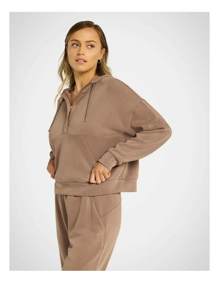 Rockwear Travel Half Zip Hoodie in Coffee, women's relaxed fit hoodie with external pocket and ultra-smooth fabric for comfort and style during travel.