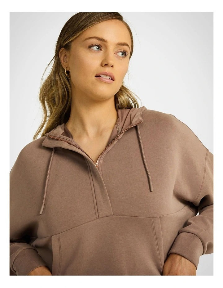 Rockwear Travel Half Zip Hoodie in Coffee, women's relaxed fit hoodie with external pocket and ultra-smooth fabric for comfort and style during travel.