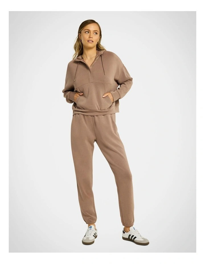 Rockwear Travel Half Zip Hoodie in Coffee, women's relaxed fit hoodie with external pocket and ultra-smooth fabric for comfort and style during travel.