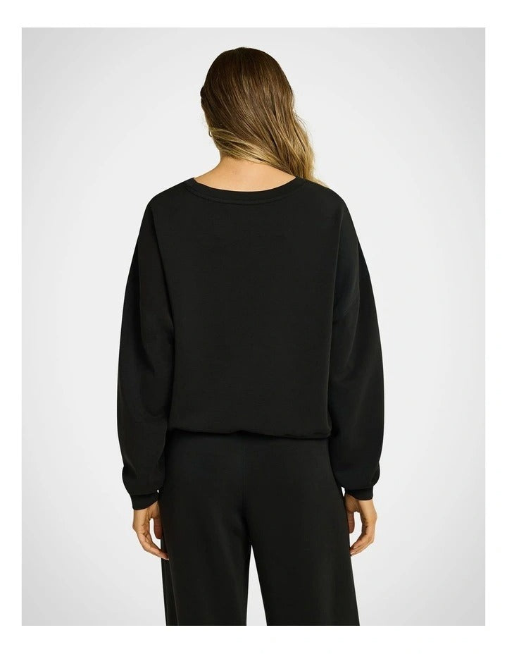 Rockwear Travel Hip Length Crew Jumper in Black, women's cozy crew neck sweater with relaxed fit and ultra-smooth fabric, perfect for travel and everyday wear.