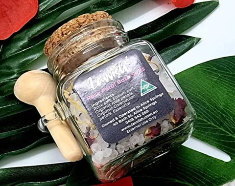 Lavvish Lavender and Rose Bath Salts in glass jar with wooden spoon and floral accents