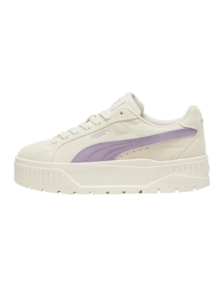White sneaker with a purple logo on a white background