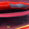 LeatherLuxe premium red leather clutch bag with gold hardware, designed for crossbody and shoulder wear, elegant women's accessory for evening and casual outings.