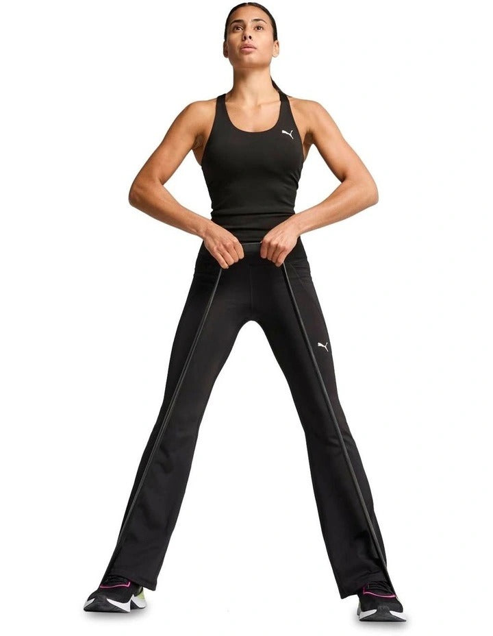 Puma Train All Day Essential 2-in-1 Women’s Tank with moisture-wicking dryCELL technology, 85% recycled polyester, 15% elastane