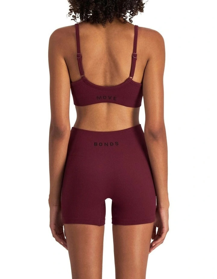 Women's Move Rib Seamless Crop Bra in ribbed fabric with removable cups, soft vee neckline, and supportive underbust elastic.