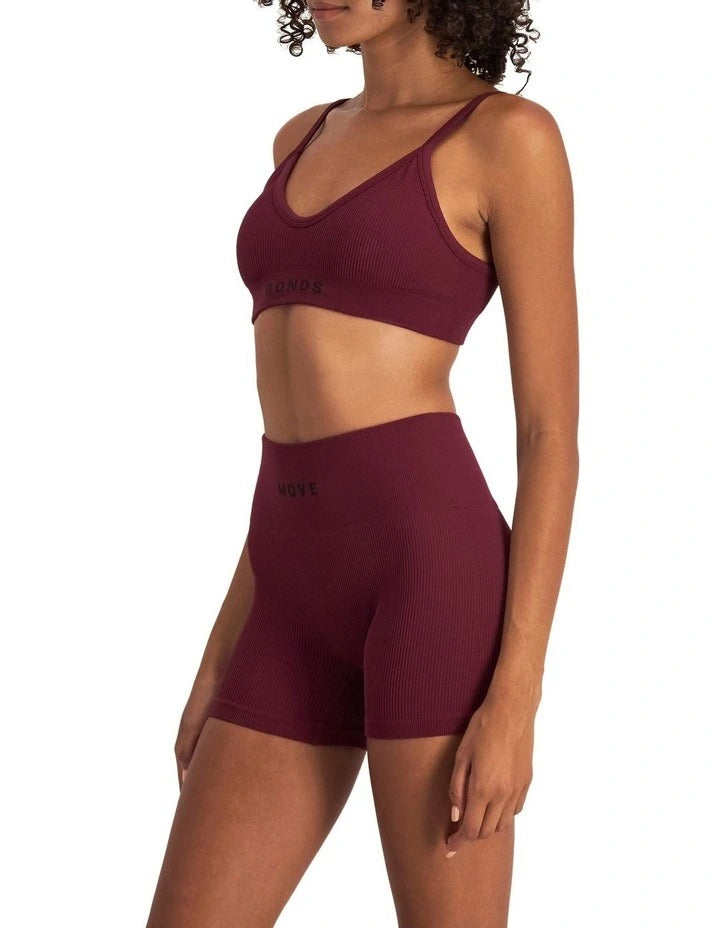Women's Move Rib Seamless Crop Bra in ribbed fabric with removable cups, soft vee neckline, and supportive underbust elastic.