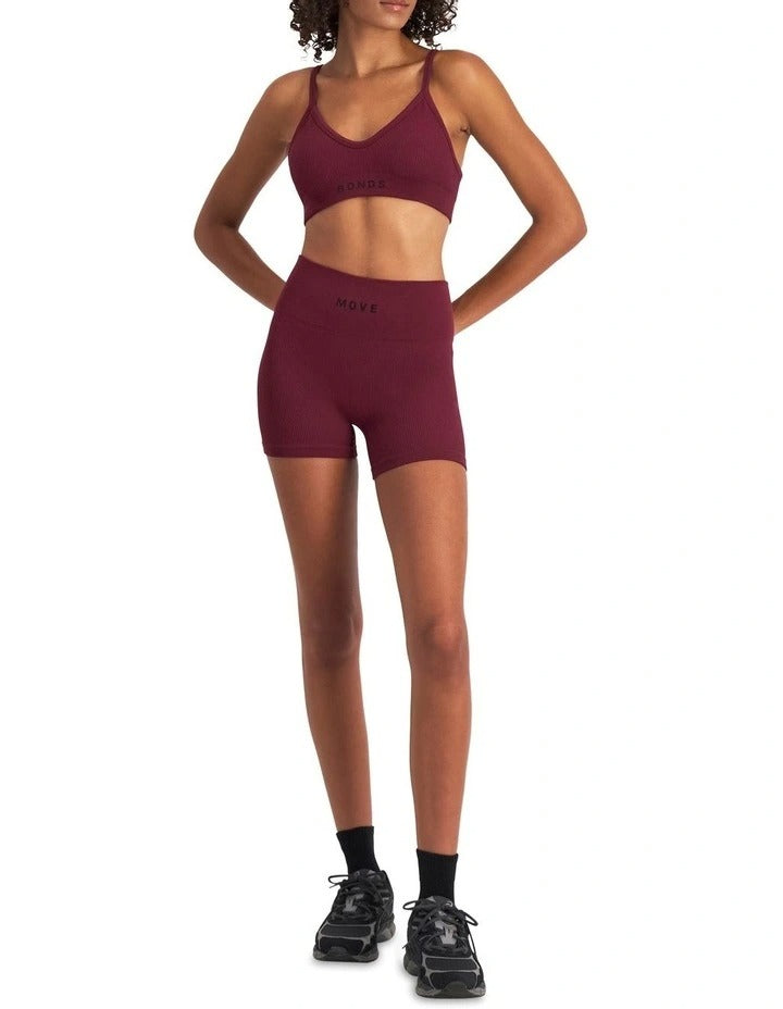 Women's Move Rib Seamless Crop Bra in ribbed fabric with removable cups, soft vee neckline, and supportive underbust elastic.