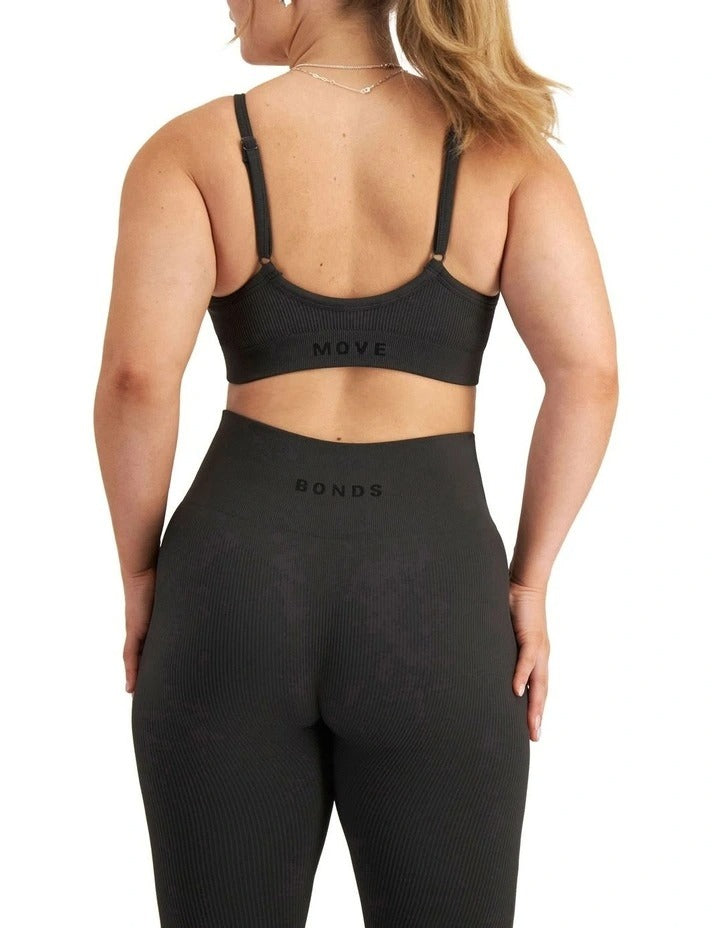 Move Rib Seamless Crop in ribbed nylon elastane with removable cups, soft vee neckline, moisture-wicking finish, and supportive underbust elastic