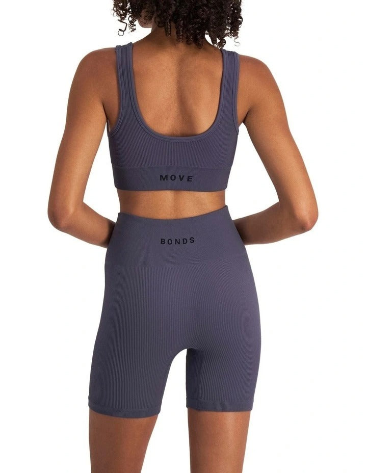 Move Rib Seamless Crop in ribbed nylon elastane fabric with removable cups, soft scoop neckline, and sweat-wicking finish for low-impact activities