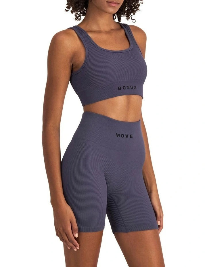 Move Rib Seamless Crop in ribbed nylon elastane fabric with removable cups, soft scoop neckline, and sweat-wicking finish for low-impact activities
