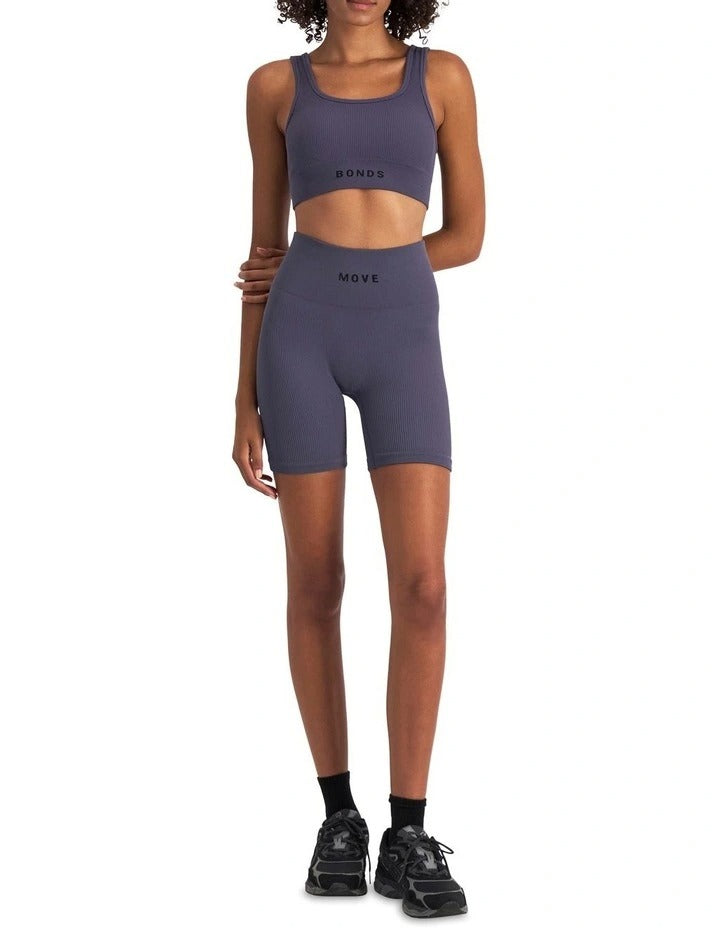 Move Rib Seamless Crop in ribbed nylon elastane fabric with removable cups, soft scoop neckline, and sweat-wicking finish for low-impact activities