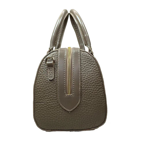 Beige genuine leather barrel shoulder bag with adjustable strap, minimalist design, and premium handcrafted finish.