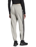 Adidas Essentials 3-Stripes Fleece Loose-Fit Joggers in Grey with soft fleece, loose fit, and iconic 3-Stripes design