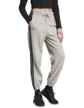 Adidas Essentials 3-Stripes Fleece Loose-Fit Joggers in Grey with soft fleece, loose fit, and iconic 3-Stripes design