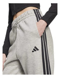 Adidas Essentials 3-Stripes Fleece Loose-Fit Joggers in Grey with soft fleece, loose fit, and iconic 3-Stripes design