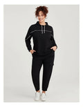 Taking Shape Active Mock Neck Top in Black with cords, ribbed cuffs, thumbholes, and flattering piping detail for plus size comfort and style.