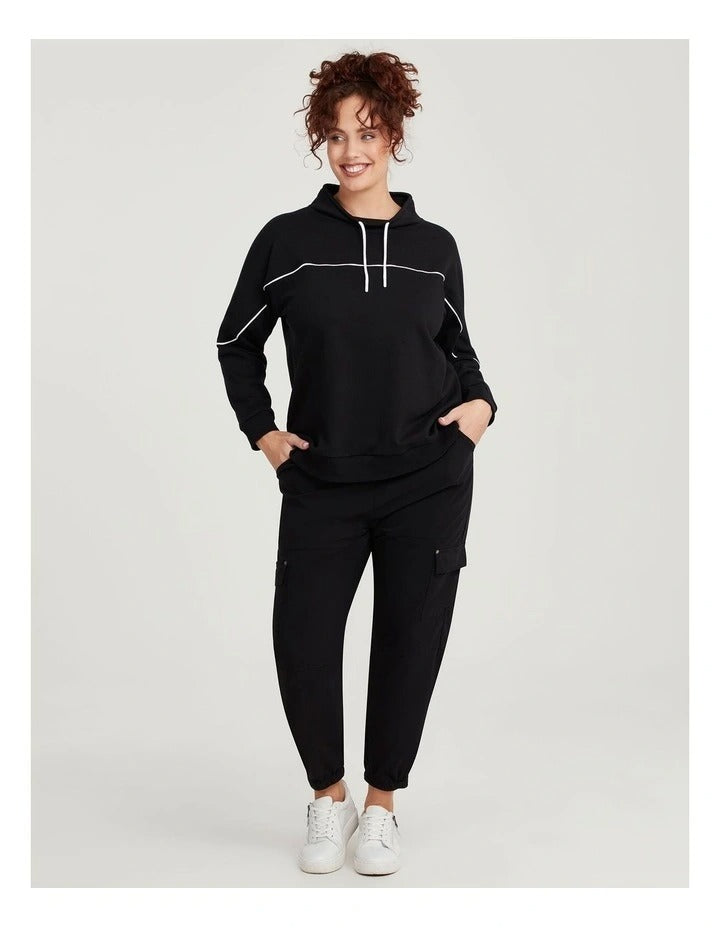 Taking Shape Active Mock Neck Top in Black with cords, ribbed cuffs, thumbholes, and flattering piping detail for plus size comfort and style.