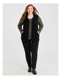 Taking Shape Teddy Vest in Black with plush teddy fabric, zip closure, high neckline, and side pockets for plus size comfort and layering.