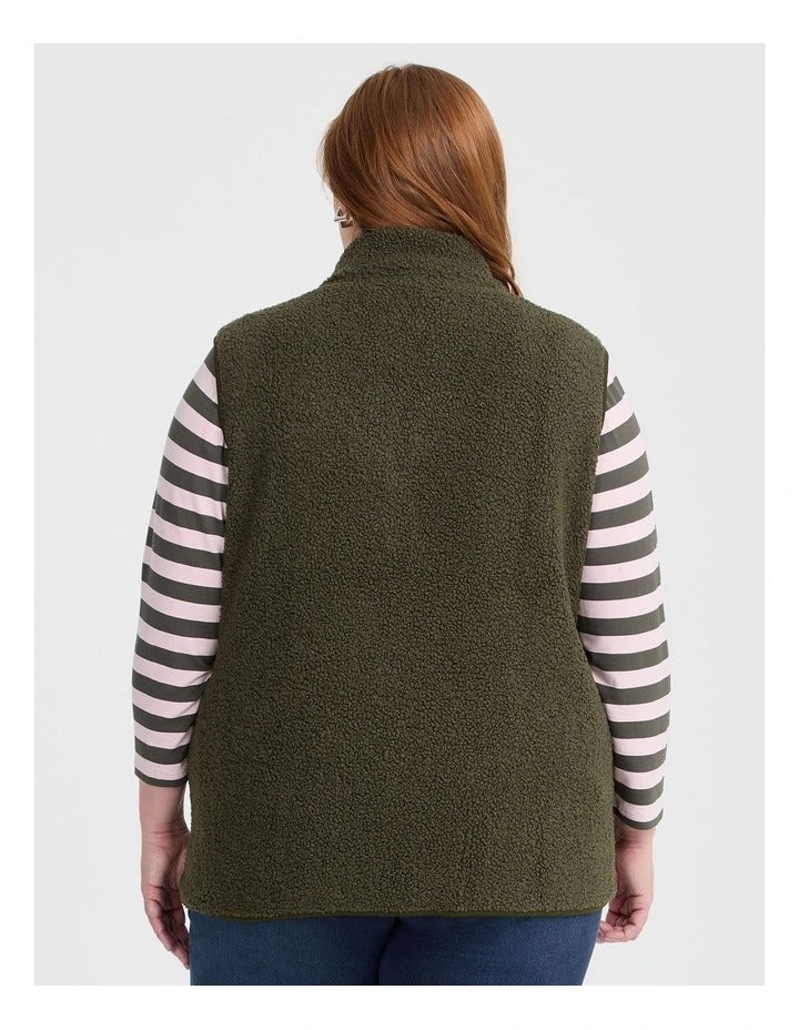 Taking Shape Teddy Vest in Olive with plush teddy fabric, zip closure, high neckline, and side pockets for plus size layering and winter style.