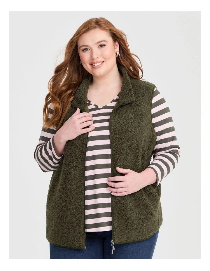 Taking Shape Teddy Vest in Olive with plush teddy fabric, zip closure, high neckline, and side pockets for plus size layering and winter style.