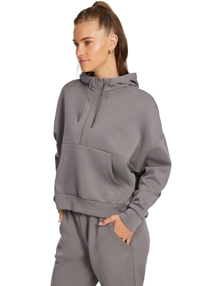 Rockwear Travel Hip Half Zip Hoodie in Almond, women's cozy hoodie with front pockets, relaxed fit, and hip-length silhouette for comfort and style.