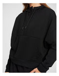 Rockwear Travel Hip Hood Half Zip in Black, featuring a cozy hood and front pockets for a relaxed, stylish look.