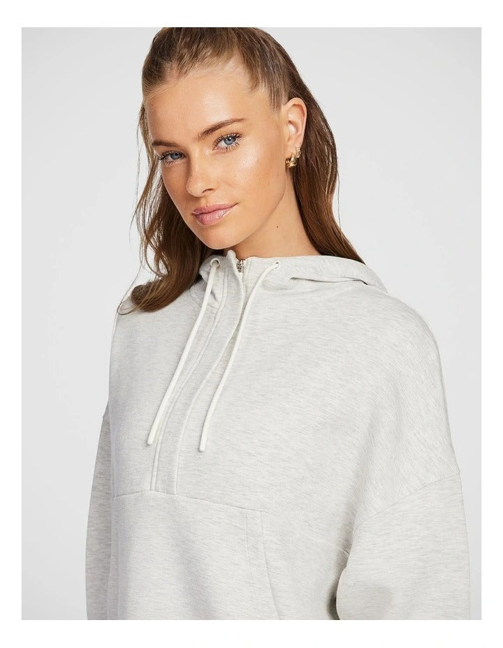 Rockwear Travel Hip Half Zip Hoodie in Grey, featuring a cozy hood and front pockets for a relaxed, stylish fit.