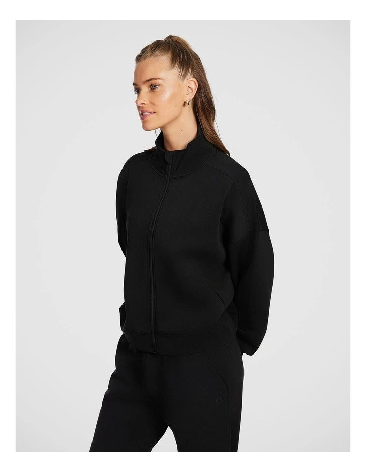 Rockwear Travel Zip Through in Black featuring cozy funnel neck and side pockets for stylish cold-weather wear.