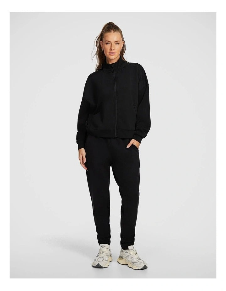 Rockwear Travel Zip Through in Black featuring cozy funnel neck and side pockets for stylish cold-weather wear.