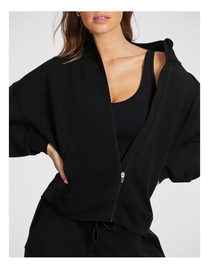 Rockwear Travel Zip Through in Black featuring cozy funnel neck and side pockets for stylish cold-weather wear.
