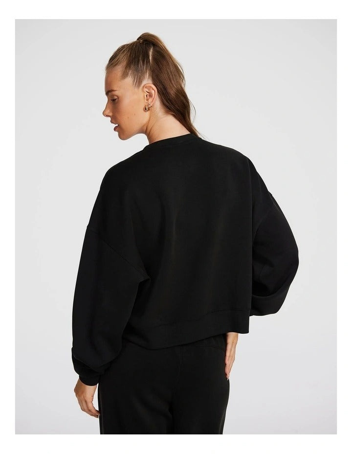 Rockwear Travel Hip Length Crew Sweater in Black, women’s relaxed fit, long sleeve sweater for everyday comfort and style.