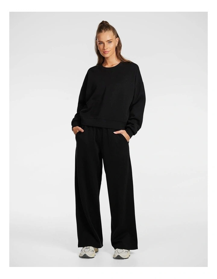 Rockwear Travel Hip Length Crew Sweater in Black, women’s relaxed fit, long sleeve sweater for everyday comfort and style.
