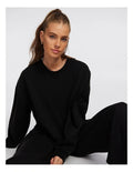 Rockwear Travel Hip Length Crew Sweater in Black, women’s relaxed fit, long sleeve sweater for everyday comfort and style.