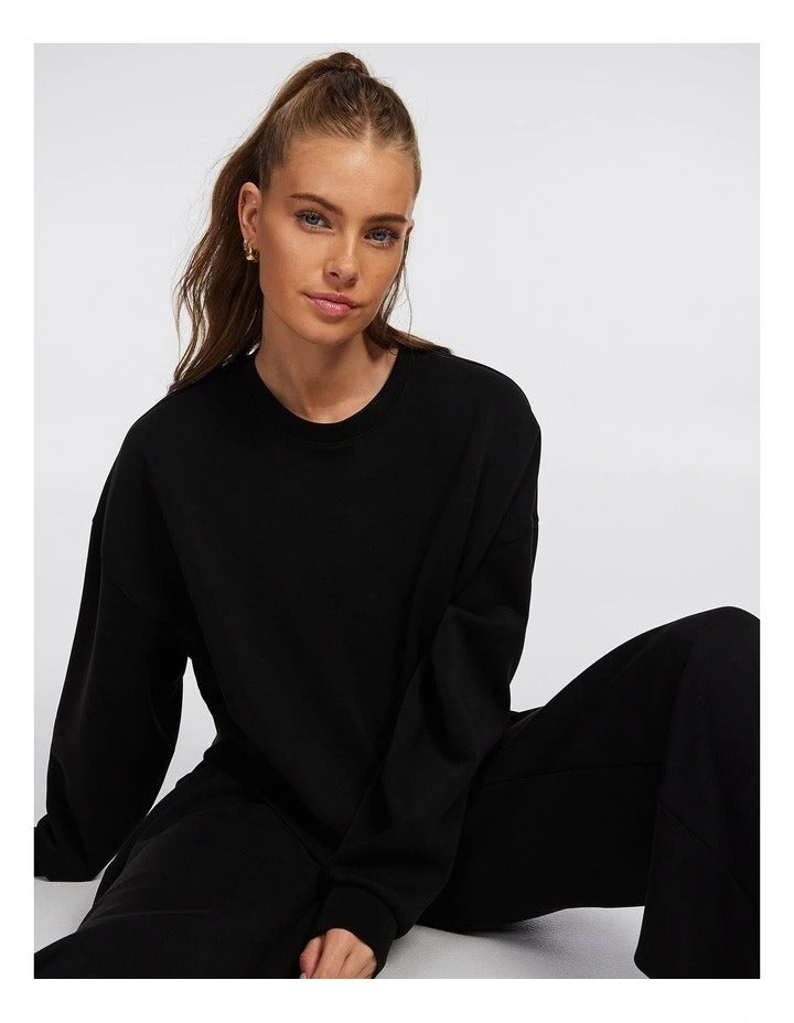 Rockwear Travel Hip Length Crew Sweater in Black, women’s relaxed fit, long sleeve sweater for everyday comfort and style.