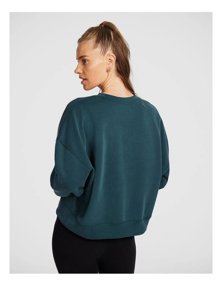 Rockwear Travel Hip Length Crew Sweater in Midnight Green, offering a cozy and relaxed fit for everyday comfort.