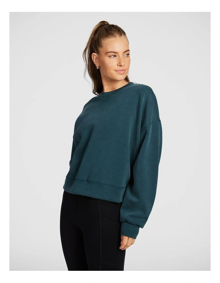 Rockwear Travel Hip Length Crew Sweater in Midnight Green, offering a cozy and relaxed fit for everyday comfort.